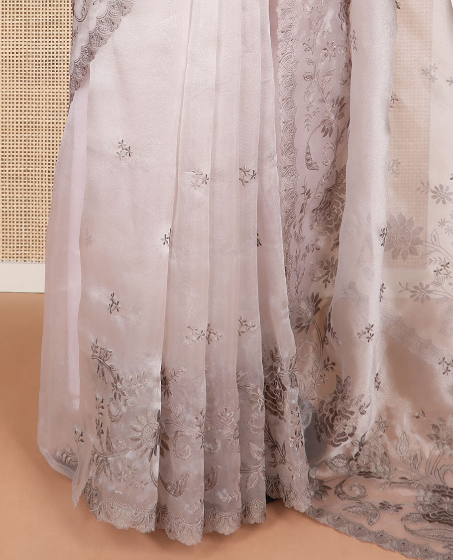 Light brown embroidered tissue organza saree with floral embroidery, scallop border & embroidery pallu along with embroidered blouse