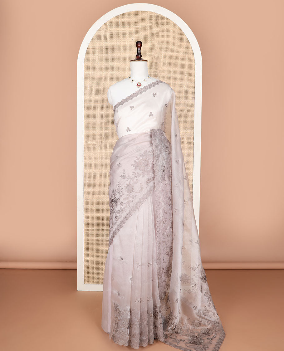 Light brown embroidered tissue organza saree with floral embroidery, scallop border & embroidery pallu along with embroidered blouse