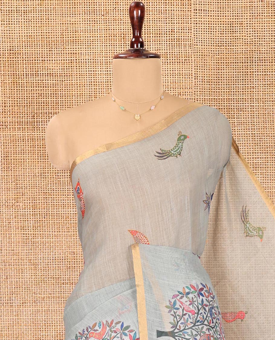 Sage Green Linen Cotton Saree, Steeped in the Richness of Nature-Themed Motifs Like Bird, Owl, and Tree, a Subtle Piping Border, Pallu of Tree Motifs, and Paired with a Matching Blouse