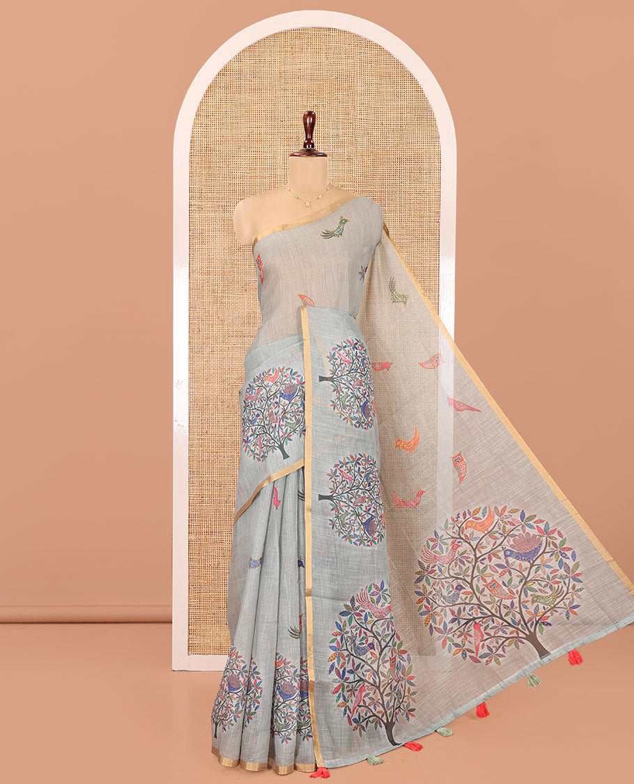 Sage Green Linen Cotton Saree, Steeped in the Richness of Nature-Themed Motifs Like Bird, Owl, and Tree, a Subtle Piping Border, Pallu of Tree Motifs, and Paired with a Matching Blouse