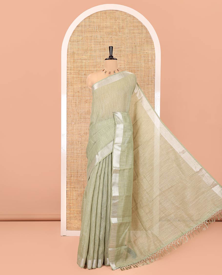 Sage Green Linen Zari Cotton Saree, Gleamed Up with Zari Stripes All Over Its Body, a Subtle Zari Border, a Self-Pallu, and Comes Without a Blouse