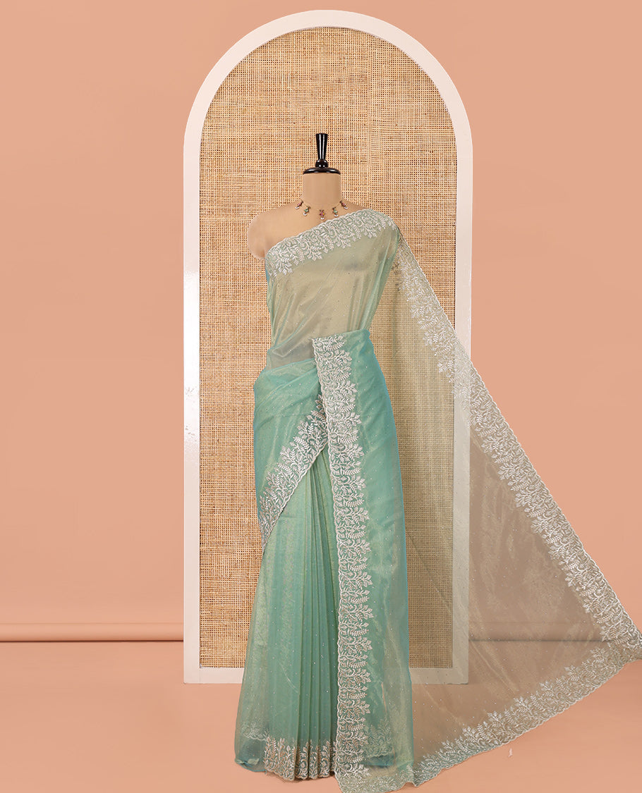Green Twill Net Saree, Gleamed Up with Stone Work, Highlighted by a Scallop Embroidered Border, and Paired with a Matching Blouse