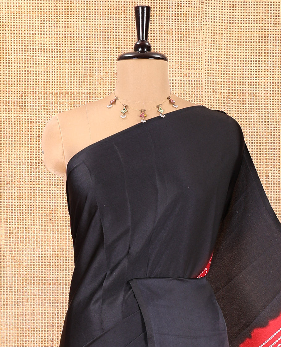 Borderless Black and Red Satin Crepe Saree, Elevated with Plain and Bandhani-Circle Print on Its Body, Intricately Bandhani Printed Pallu, and Paired with a Contrast Blouse