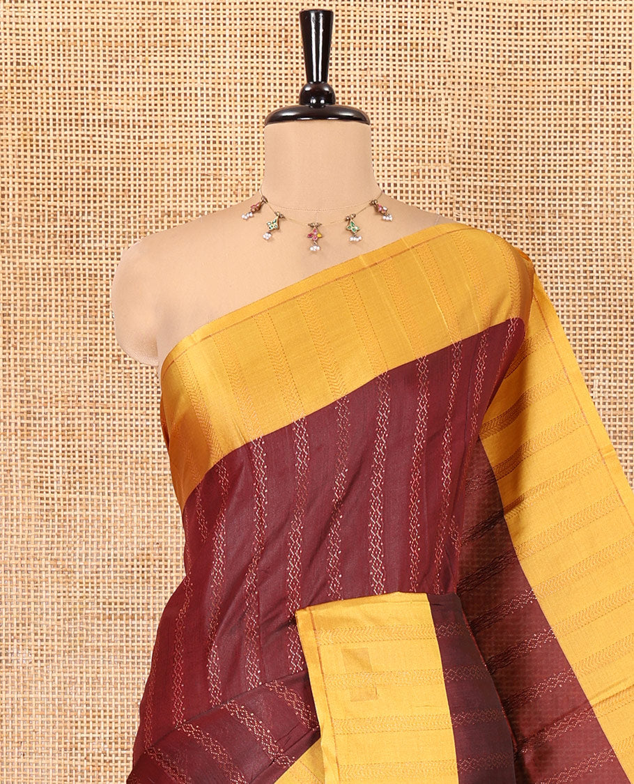 Maroon Kanchi Soft Silk Saree, Enriched with Chevron Stripes on Its Body, Complemented by a Contrast Chevron Striped Border, Striped Pallu, and Paired with a Contrast Blouse