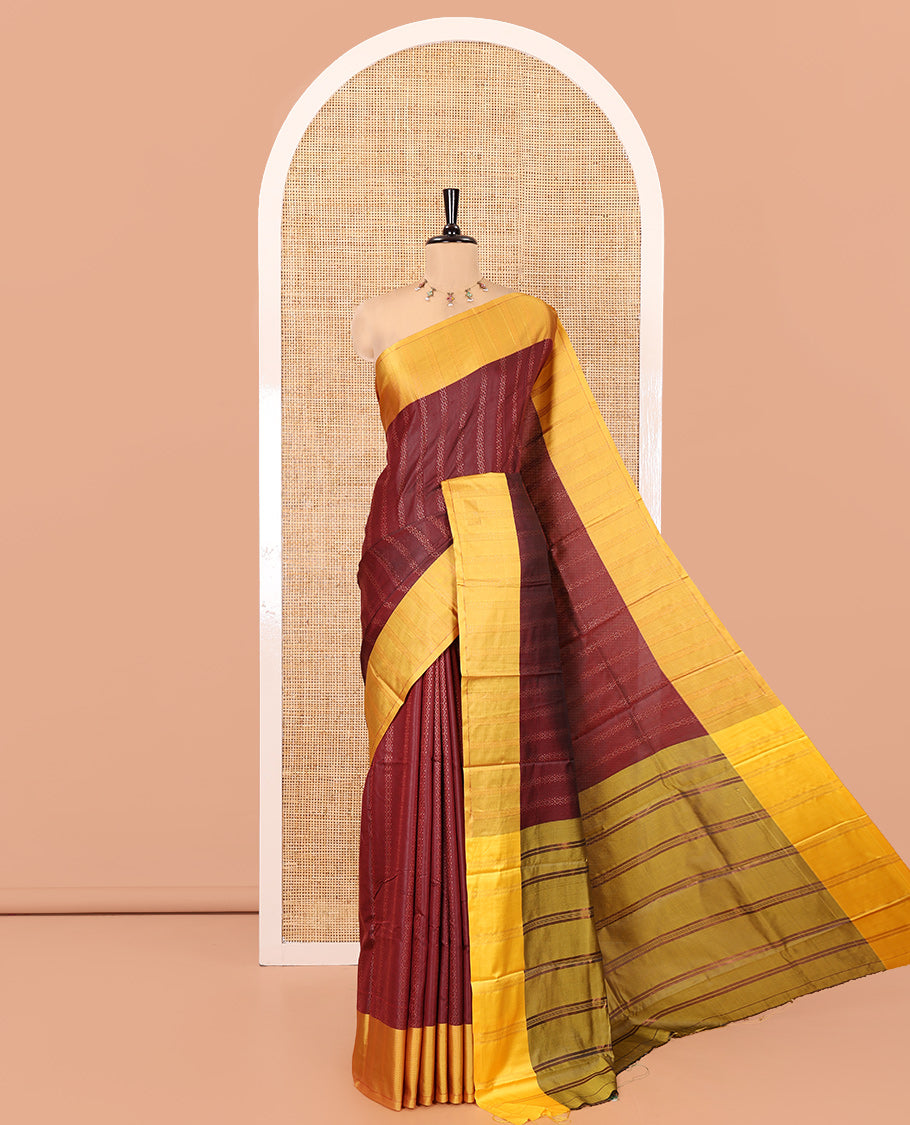 Maroon Kanchi Soft Silk Saree, Enriched with Chevron Stripes on Its Body, Complemented by a Contrast Chevron Striped Border, Striped Pallu, and Paired with a Contrast Blouse