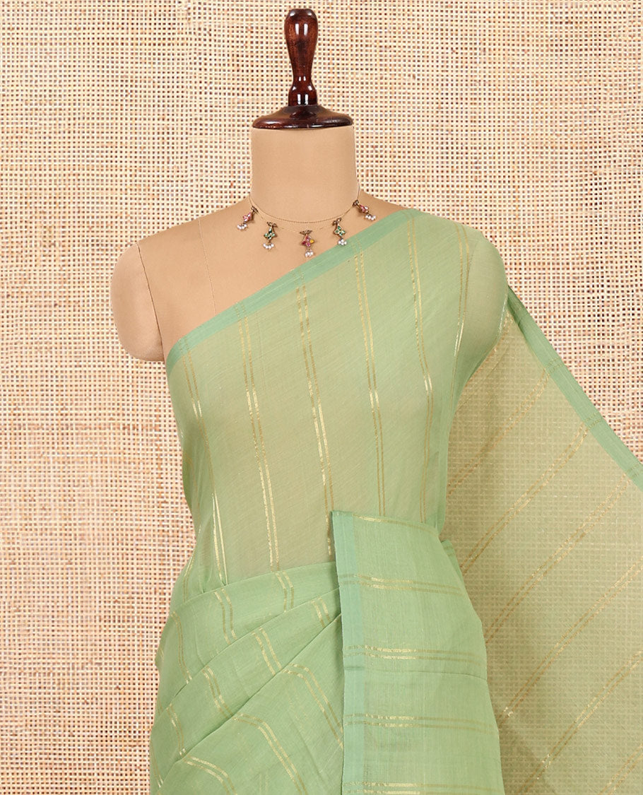 Borderless Pista Green Khadi Mul Cotton Saree, Adorned with Vertical Zari Stripes, a Self-Pallu, and No Blouse