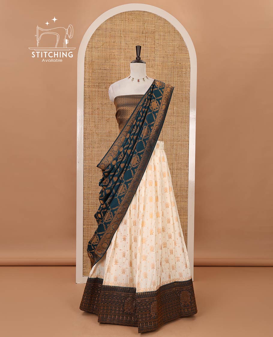 Cream semi-banaras half-saree, zari buttas & contrast Swarovski stonework traditional border skirt, jacquard blouse & contrast jaal jacquard peacock blue dhavani