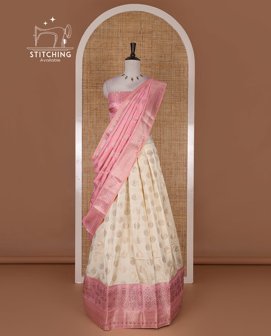 Cream and onion pink semi-banarasi half-saree, zari buttas with contrast swarovski stone work border skirt, contrast zari buttas blouse, and intricate zari dhavani
