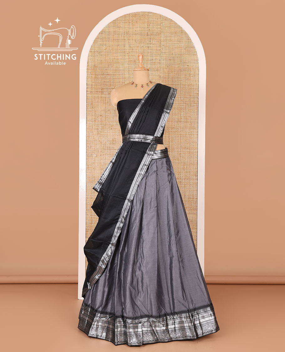 Grey taffeta silk half-saree, plain with a contrast traditional design bordered skirt, contrast blouse, and traditional zari bordered blouse