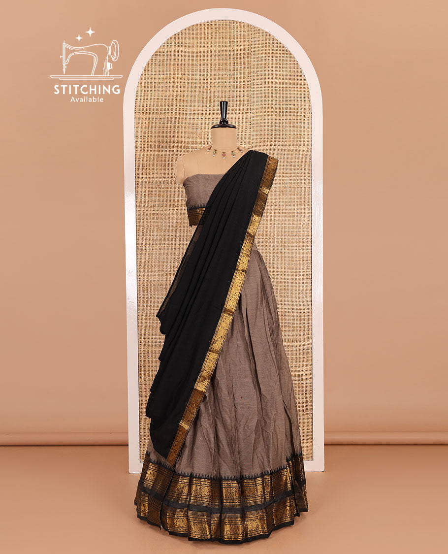 Grey-black sungudi cotton half-saree, plain with contrast traditional zari varisai pettu bordered skirt, a matching blouse, and a zari bordered dhavani