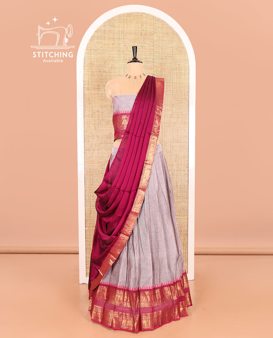 Steel Grey-Rani Pink Chettinad Cotton Half-Saree Featuring a Plain Skirt, Highlighted with a Contrast Peacock-Elephant Motifs Woven Rettai Pettu Zari Border, a Subtly Woven Matching Blouse, and a Vichitra Silk Contrast Traditional Zari-Bordered Dhavani