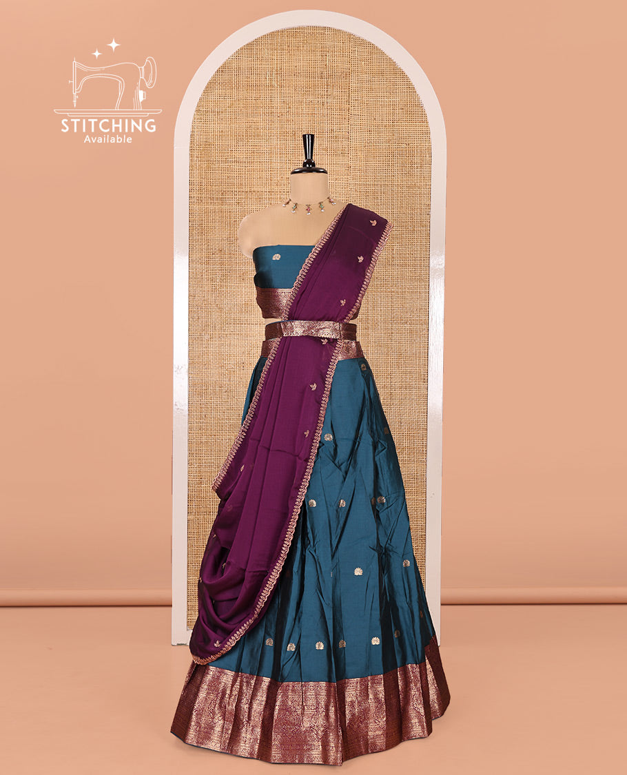 Blue and Purple Semi-Banarasi Half-Saree, Elevated with Zari Buttas on Its Skirt, Complemented by a Contrast Traditional Zari Designs Woven Border, Paired with a Matching Blouse, and a Satin Georgette Embroidered Scallop Dhavani