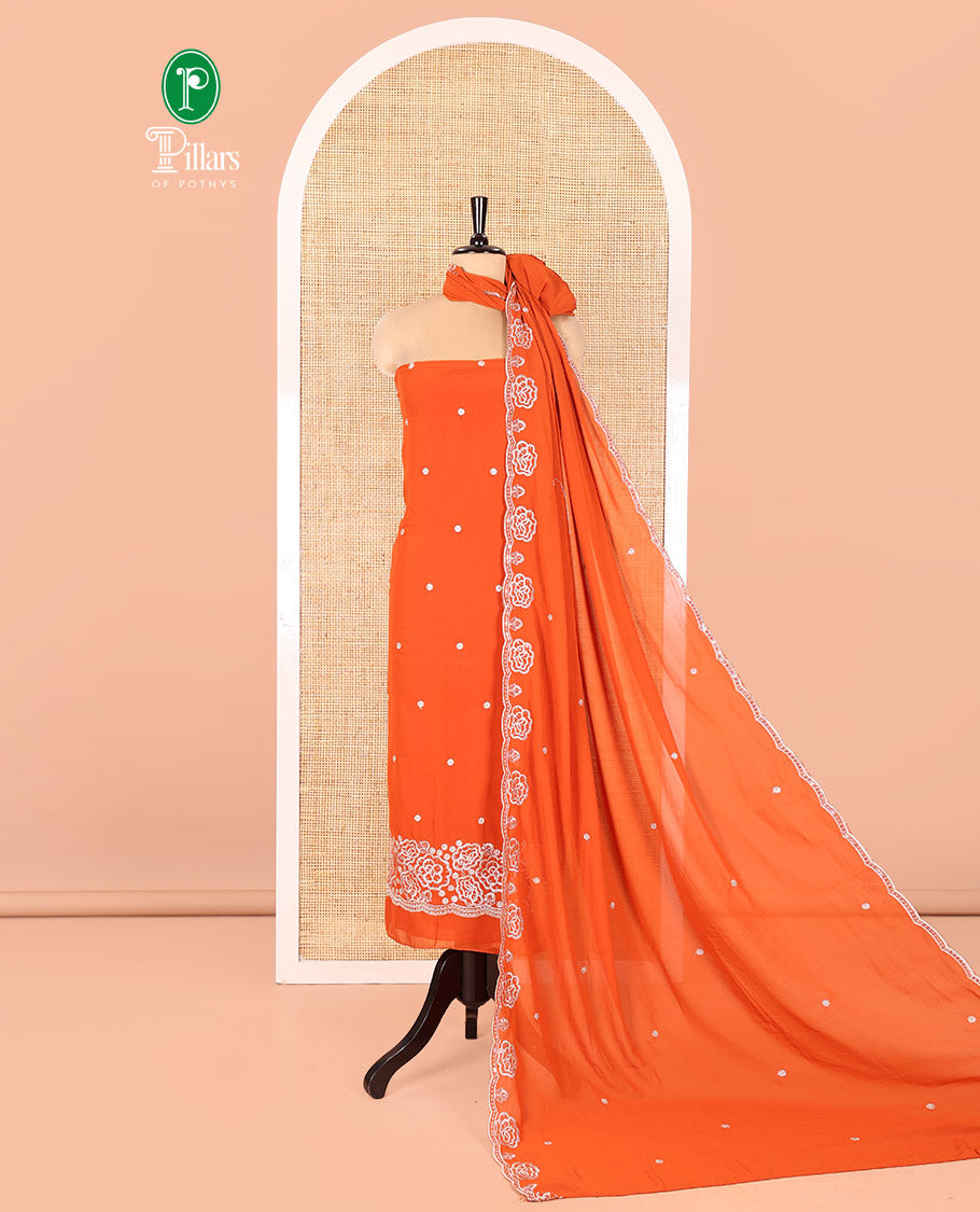 Rust Fox Georgette Material Chudidar Set, Woven with Floral Embroidery on Its Top, a Plain Santoon Bottom, and Paired with a Rose Floral Embroidered Scallop Dupatta