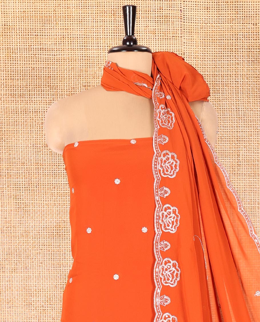 Rust Fox Georgette Material Chudidar Set, Woven with Floral Embroidery on Its Top, a Plain Santoon Bottom, and Paired with a Rose Floral Embroidered Scallop Dupatta
