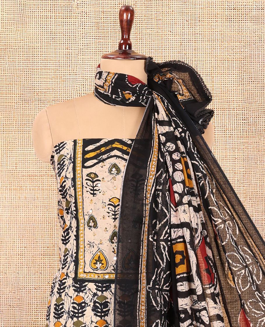 Black-Yellow Cotton Material Chudidar Features Batik-Printed Top, a Contrast-Printed Bottom, Batik-Printed Dupatta