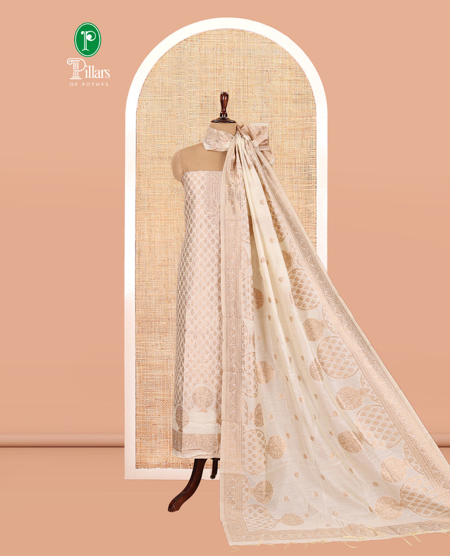Kerala Cream Banarasi-Silk Material Churidar, Elevated with Zari Buttas Top, a Plain Bottom, and Intrircate Dhavani