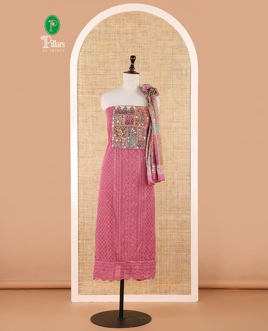 Pink churidar material set, Ajrakh-printed neck with Schiffli embroidery & mirror work georgette top, kalidoscopic-colored dupatta of ajrakh print & mirror embroidery & plain crepe bottom
