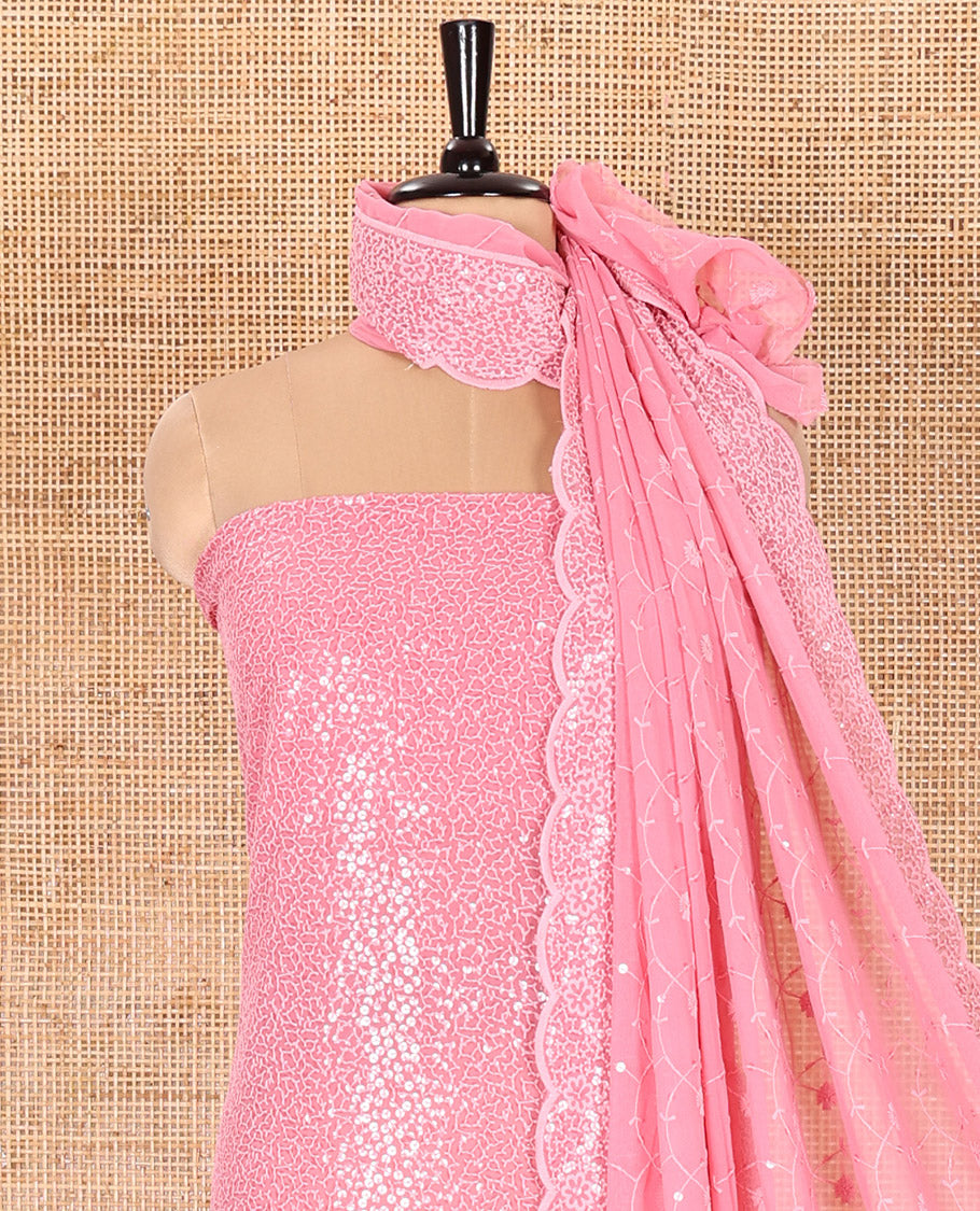 Pink Material Chudidar Set Features Sequin Embroidered Georgette Top, a Plain American Crepe Bottom, and a Scallop Dupatta Embellished with Floral Vine Embroidery