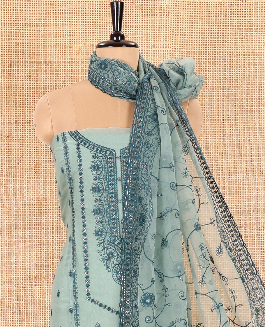 Green Material Chudidar Set Adorned with Embroidered Organza Chiffon Top, Subtly Made Plain Santoon Bottom, and a Organza Dupatta Featuring Floral Jaal Embroidery