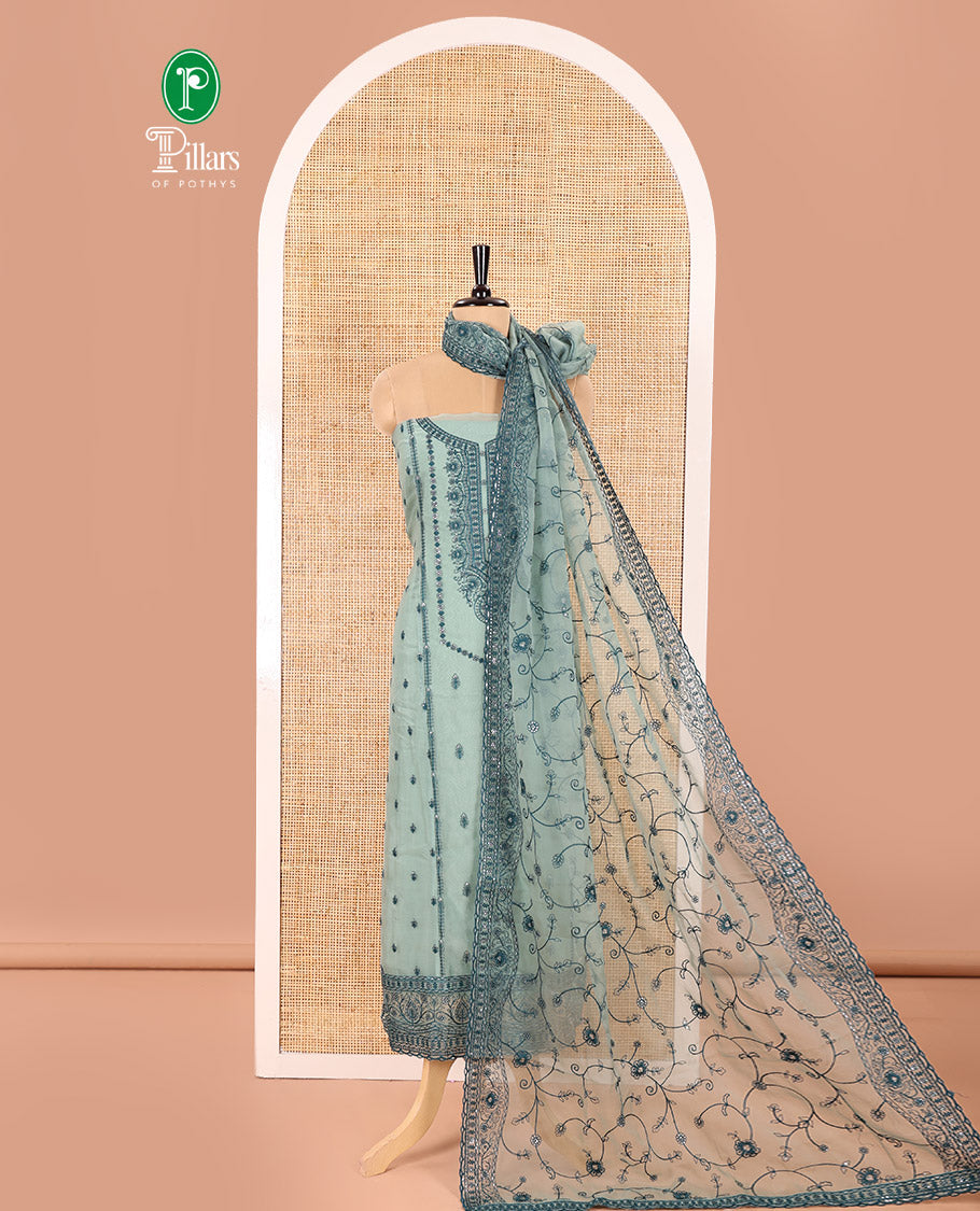 Green Material Chudidar Set Adorned with Embroidered Organza Chiffon Top, Subtly Made Plain Santoon Bottom, and a Organza Dupatta Featuring Floral Jaal Embroidery