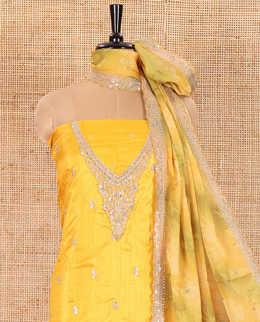 Yellow Material Chudidar Set Beautified with Intricately Embroidered Muga Silk Top, Subtly Made Plain Santoon Bottom, and a Bemberg Chiffon Dupatta Featuring Floral Printed, and Embroidery