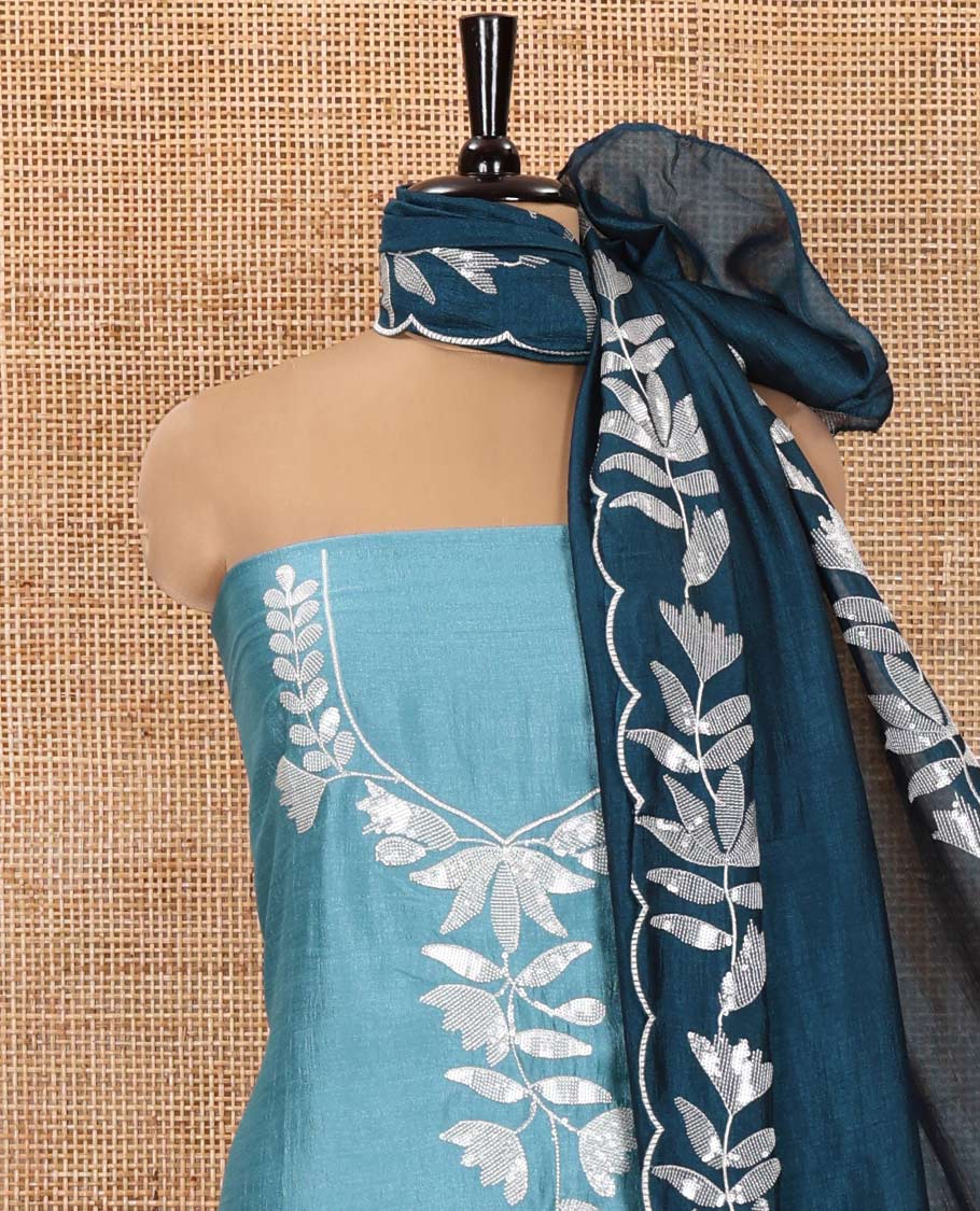 Sky Blue Material Churidar Set, Detailed with Floral Motifs Sequins-Thread Embroidered on Its Vichitra Silk Top, Comes with a Contrast Santoon Bottom, and Paired with a Vichitra Silk Floral Embroidered Scallop Dupatta