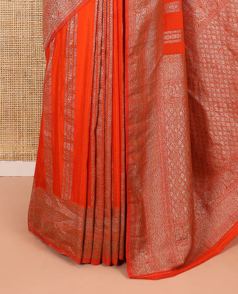 Orange Fancy Khaddi Georgette Elevated with Geometric Patterns in Zari, Subtly Woven Border Steeped with Traditional Designs, Richly Woven Pallu of Jaal Designs, and Paired with a Matching Blouse