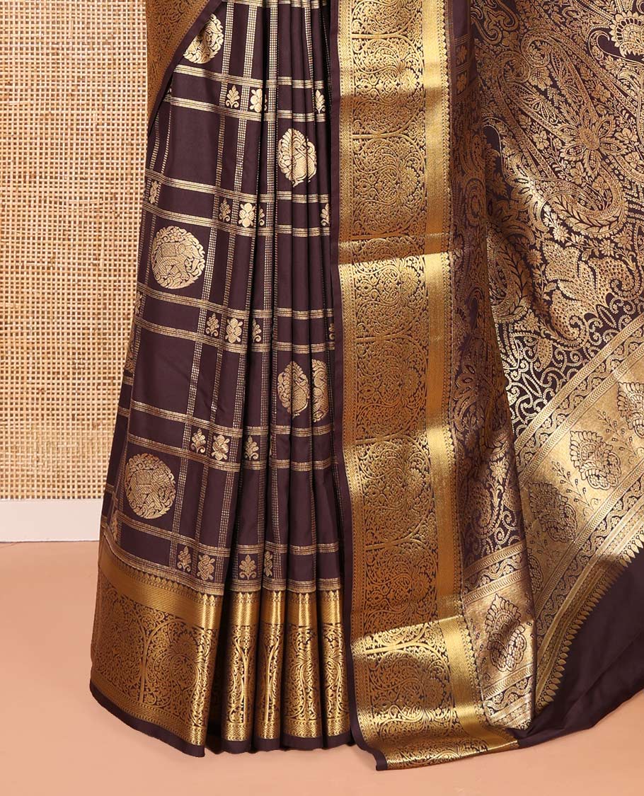 Brown Kanchipuram budget silk saree artfully woven with chakram zari butta enclosed checks all over its body, complemented by zari traditional design border, Mughal-style intricately woven pallu, and paired with a Matching blouse