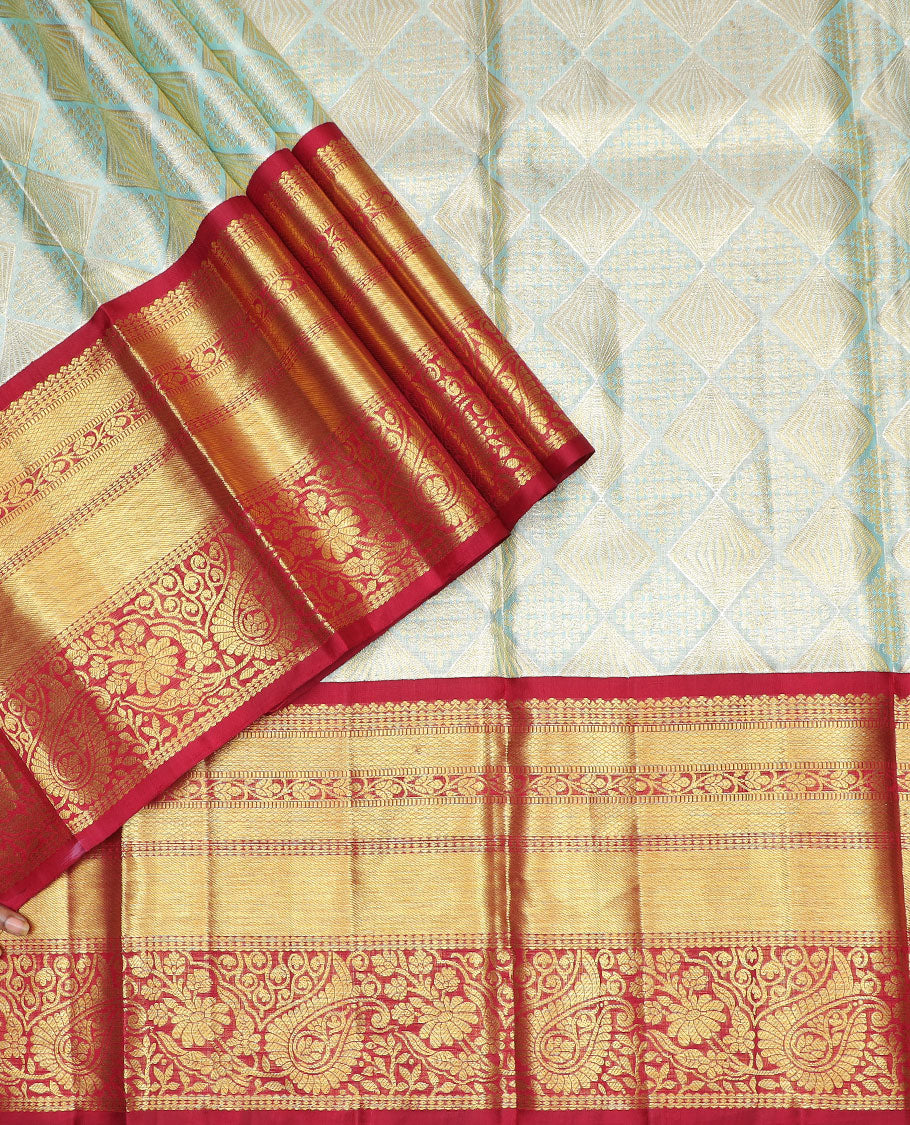 Light green floral design silk half saree with contrast thilakam mokku, kuyil kann, rekku design border, zari design blouse & zari design border dhavani