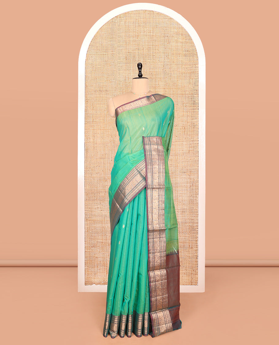 Sea Green Silk Cotton Saree, Elevated with Buttas, Complemented by Contrast Traditional Paisley Zari Design Border, Zari-Decked Pallu, and a Contrast Blouse
