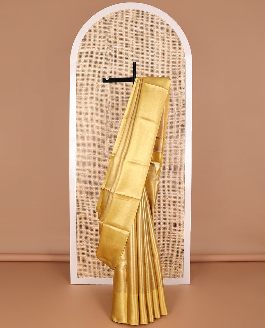 Yellow chevron design tissue saree with contrast striped border & zari design pallu
