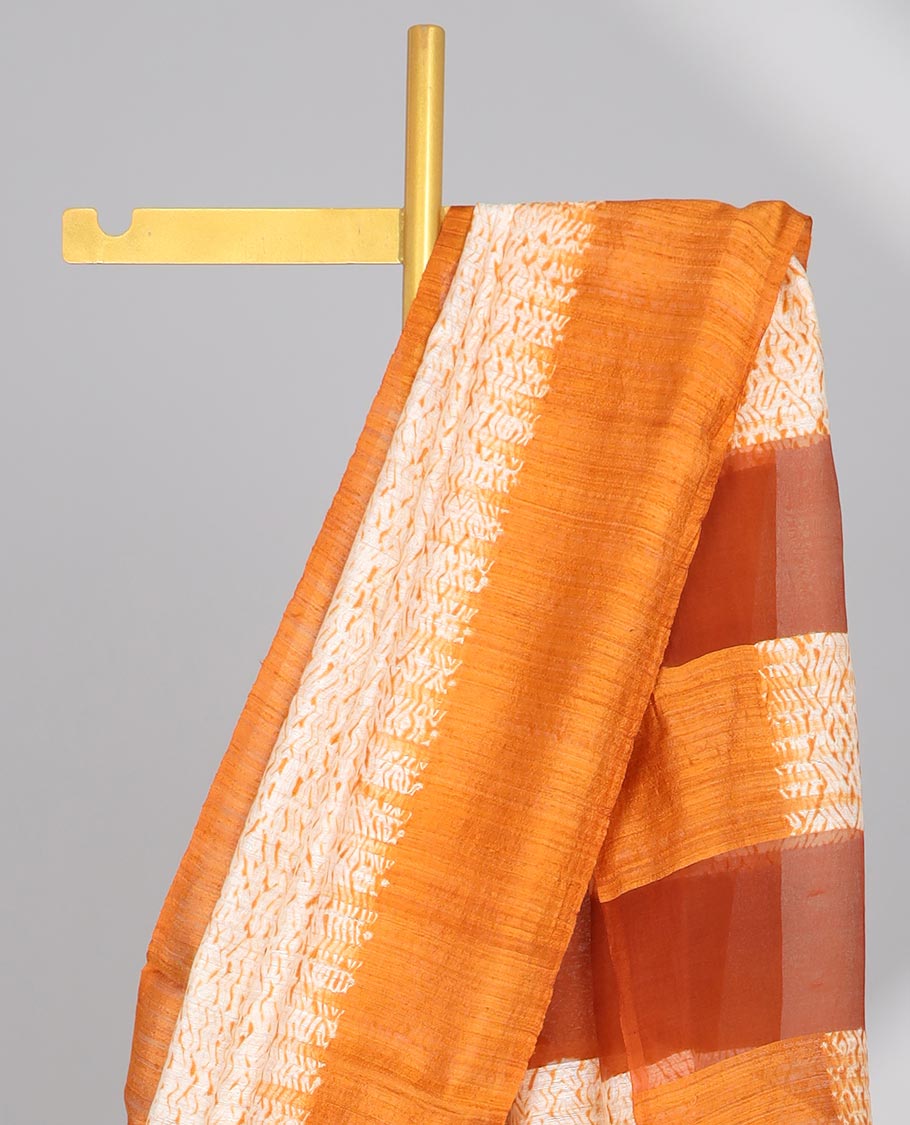Cream abstract design matka silk saree with contrast plain border & orange abstract design pallu