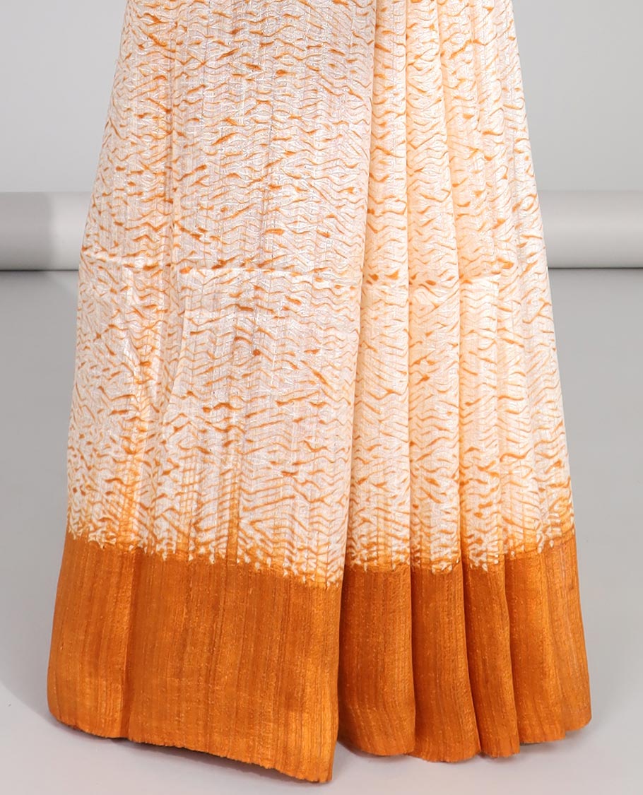 Cream abstract design matka silk saree with contrast plain border & orange abstract design pallu