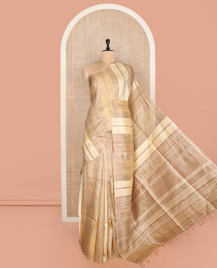 Sandal Tussar Silk Saree, Gleamed Up with Zari Stripes, a Subtle Border, Pallu of Stripes, and a Matching Blouse