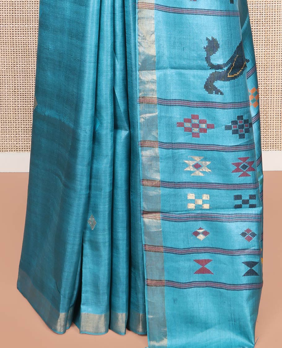 Blue Tussar Silk Saree, Subtly Woven with Multi-Color Diamond Buttas All Over Its Body, Subtle Bavanji Border, Pallu Depicts Animal and Geometric Designs, and Paired with a Matching Blouse