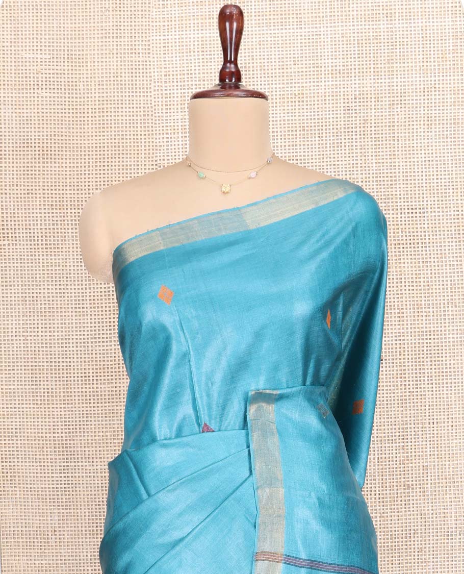 Blue Tussar Silk Saree, Subtly Woven with Multi-Color Diamond Buttas All Over Its Body, Subtle Bavanji Border, Pallu Depicts Animal and Geometric Designs, and Paired with a Matching Blouse