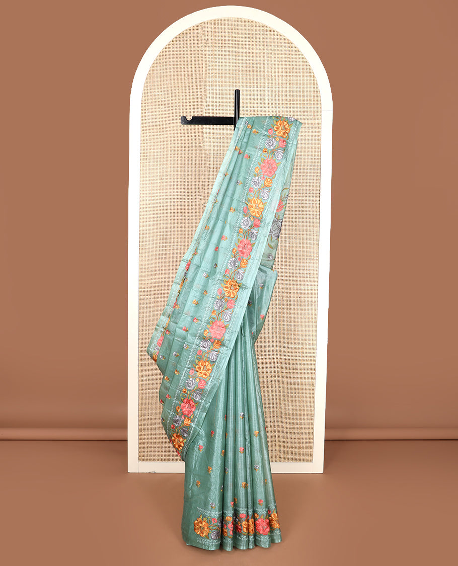 Green floral motifs, multi-color thread embroidered tussar saree, floral vine thread embroidered border, and pallu