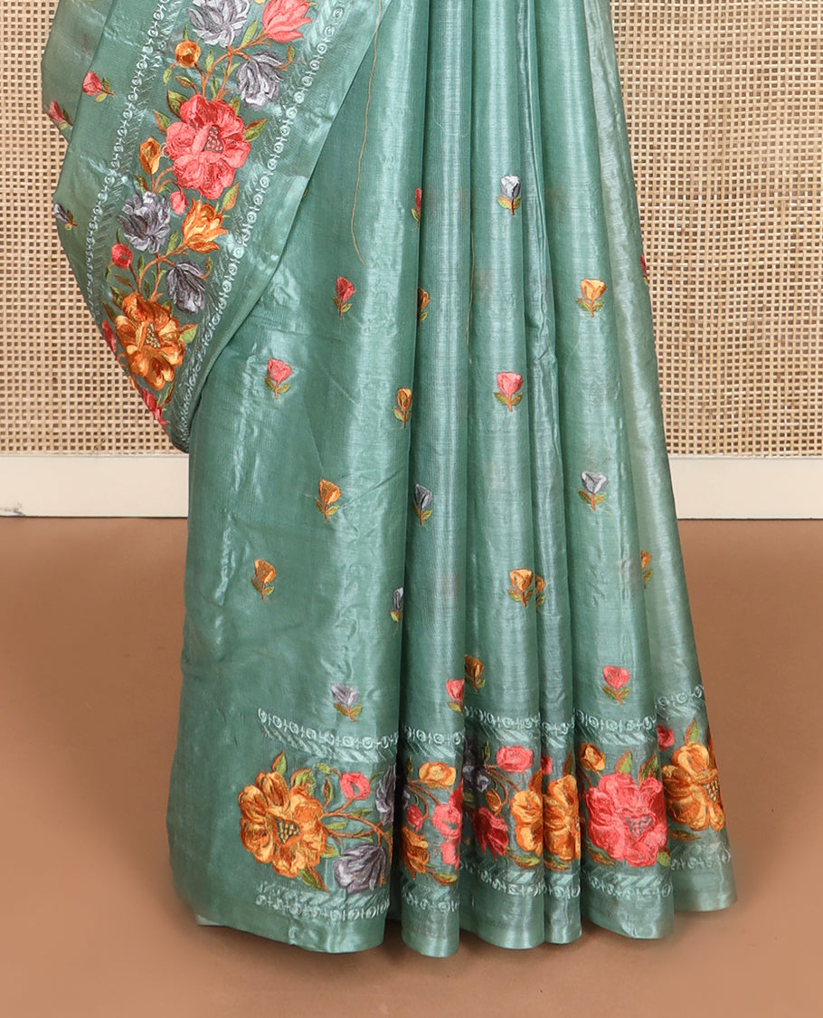 Green floral motifs, multi-color thread embroidered tussar saree, floral vine thread embroidered border, and pallu