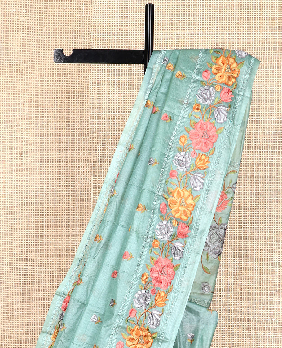 Green floral motifs, multi-color thread embroidered tussar saree, floral vine thread embroidered border, and pallu