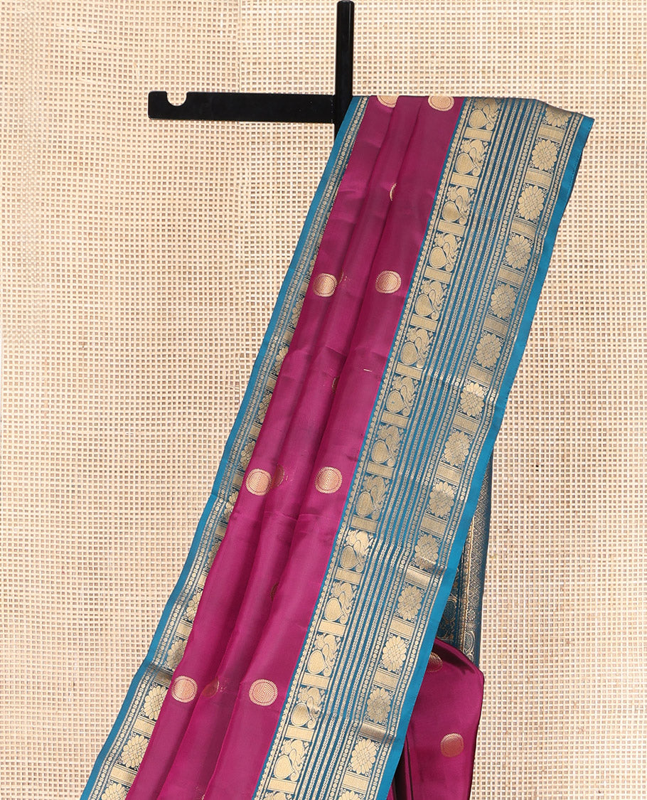 Purple Vasundhara Lite Silk Mix Saree, Embellished with Poun Buttas All Over Its Body, Complemented by a Contrast Border of Mayil, Cros Neli, Kamalam, and Chakram Designs, Elegantly Designed Pallu, and Paired with a Contrast Blouse