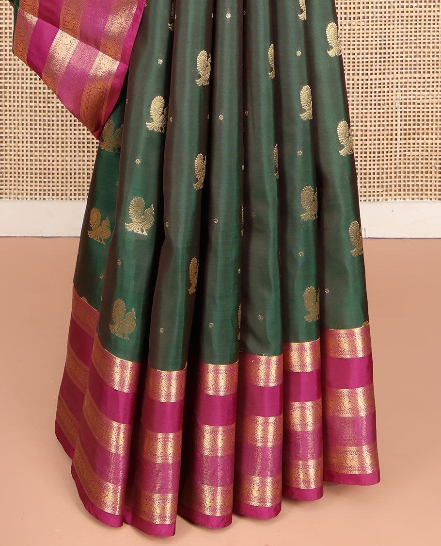 Green Vasundhara Lite Silk Mix Saree, Graced with Mayil Buttas All Over Its Body, Complemented by a Contrast Border of Neli, Muthu, and Chakram Designs, Pallu Steeped with Traditional Designs, and Paired with a Contrast Blouse