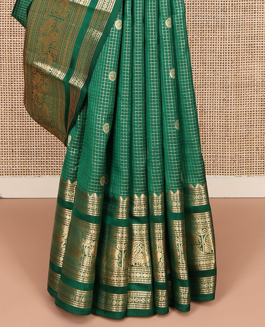 Green Vasundhara Lite Silk Mix Saree, Adorned with Mayil-Chakram Buttas and Zari Checks On Its Body, Highlighted by Zari Border of Rekku, Rudraksham, Mayil, and Kuthirai Designs, Grand Jaal Pallu and Paired with a Matching Blouse