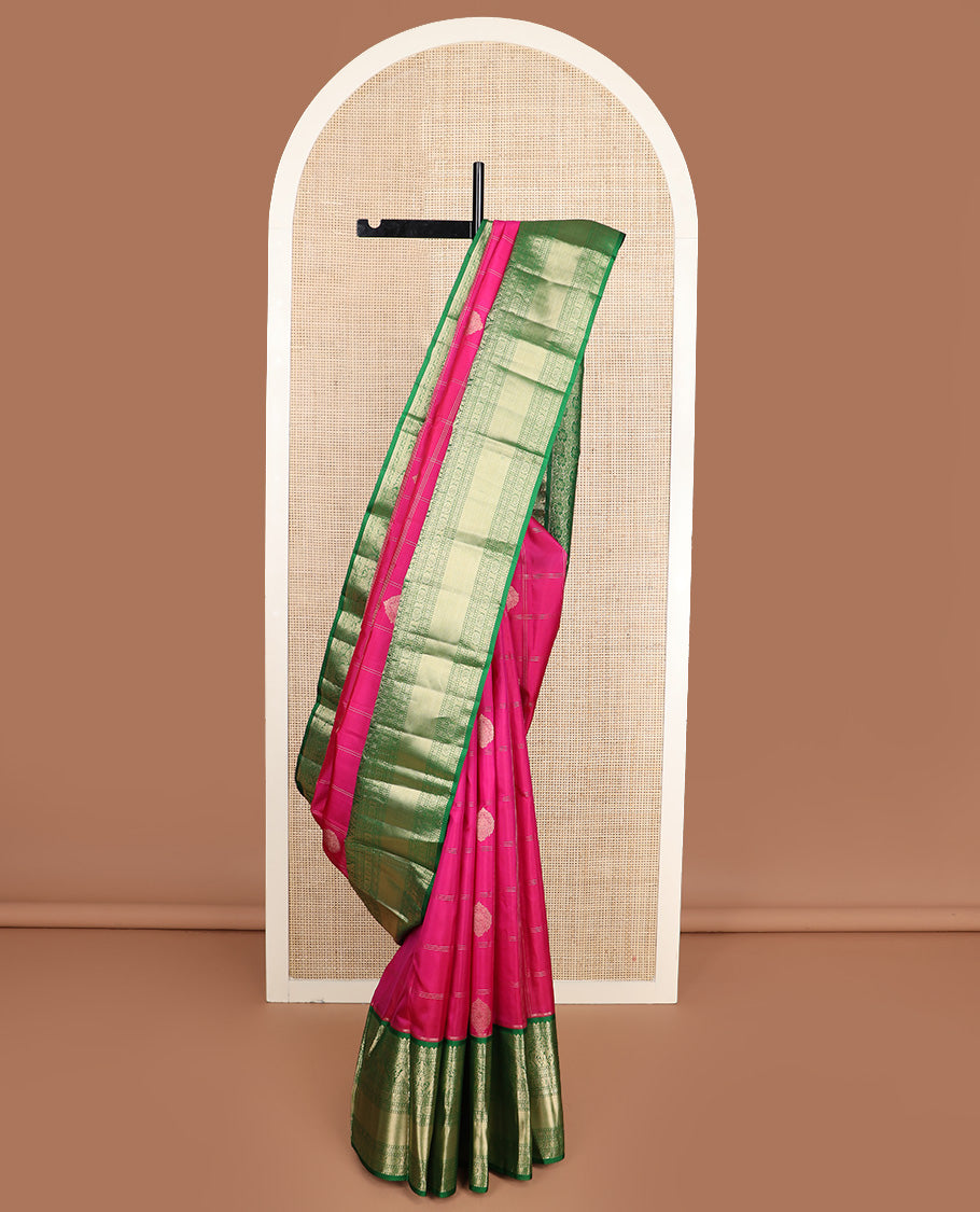 Dark pink zari buttas and checked silk saree, contrast border of rekku, muthu, diamond, yaanai, and chakram designs, and floral jaal pallu