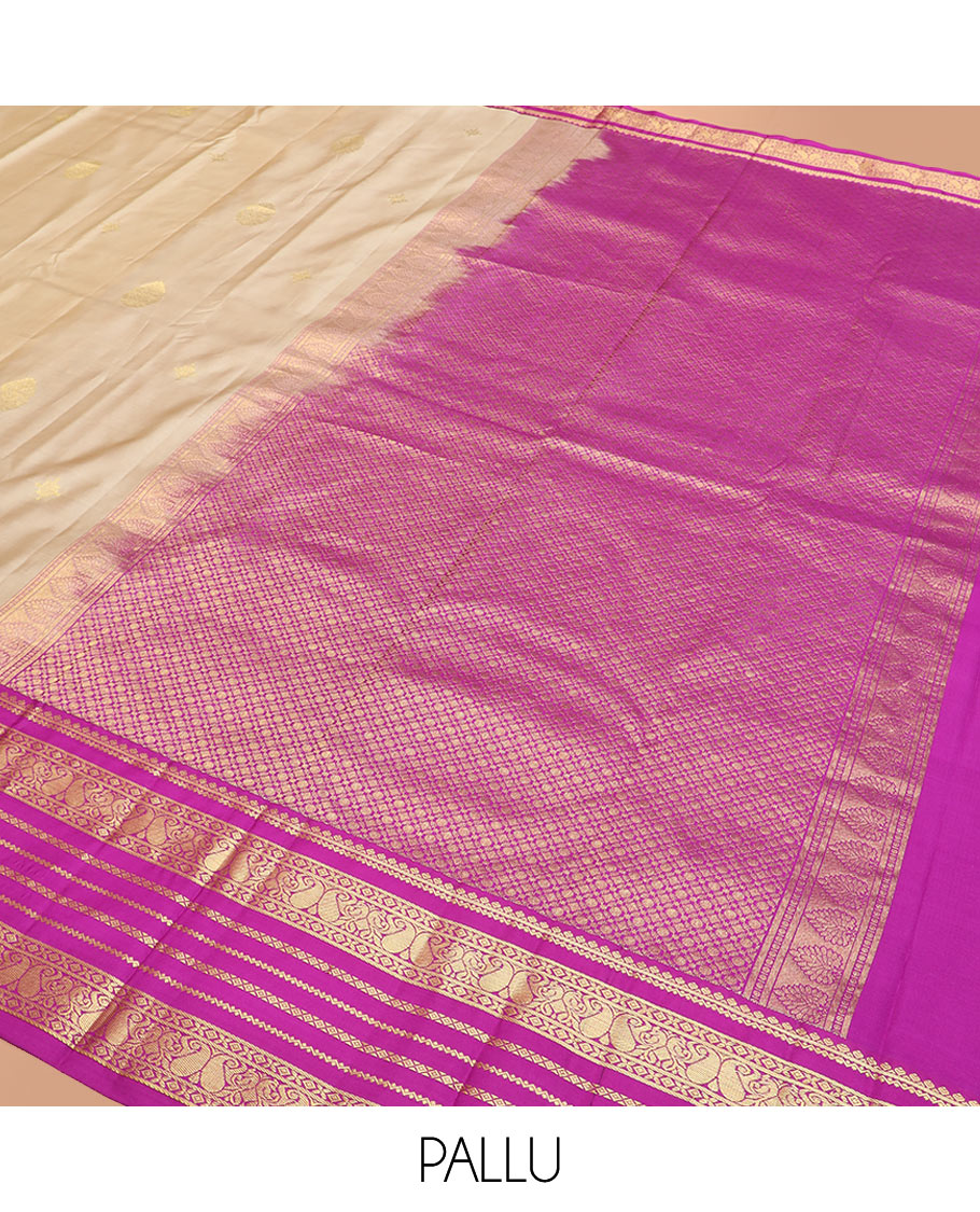 Sandal Vasundhara Silk Saree Adorned with Zari Buttas, Complemented by a Contrast Varisai Pettu Border of Neli, Diamond, and Manga Designs, Pallu Gleamed Up with Jaal Designs, and Paired with a Contrast Zari-Bordered Blouse