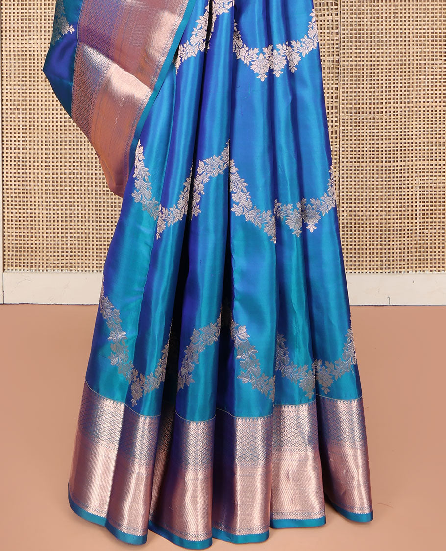 Blue Vasundhara Silk Saree, Delicately Woven with Jaal Jacquard Design All Over Its Body, Highlighted by a Zari Border of Thilakam Mokku, Jaal, and Lavangam Designs, Grand Jaal Pallu, and Paired with a Matching Blouse
