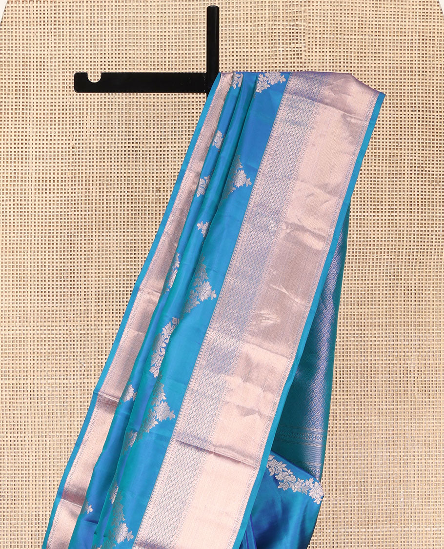 Blue Vasundhara Silk Saree, Delicately Woven with Jaal Jacquard Design All Over Its Body, Highlighted by a Zari Border of Thilakam Mokku, Jaal, and Lavangam Designs, Grand Jaal Pallu, and Paired with a Matching Blouse
