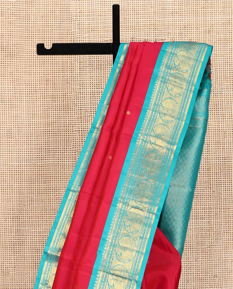 Red Vasundhara Silk Saree, Sparsely Woven with Zari Buttas All Over Its Body, Complemented by a Contrast Border of Rekku, Banaras, Diamond, and Round Mayil Designs, Grand Jaal-Patterned Pallu, and Paired with a Contrast Blouse