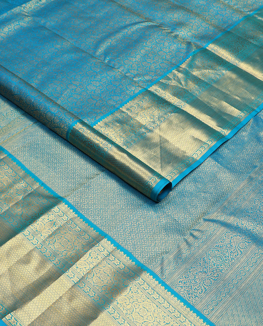 Blue floral jacquard Kanchipuram wedding silk saree, zari border of floral, manga, and mayil kann designs, and jaal pallu