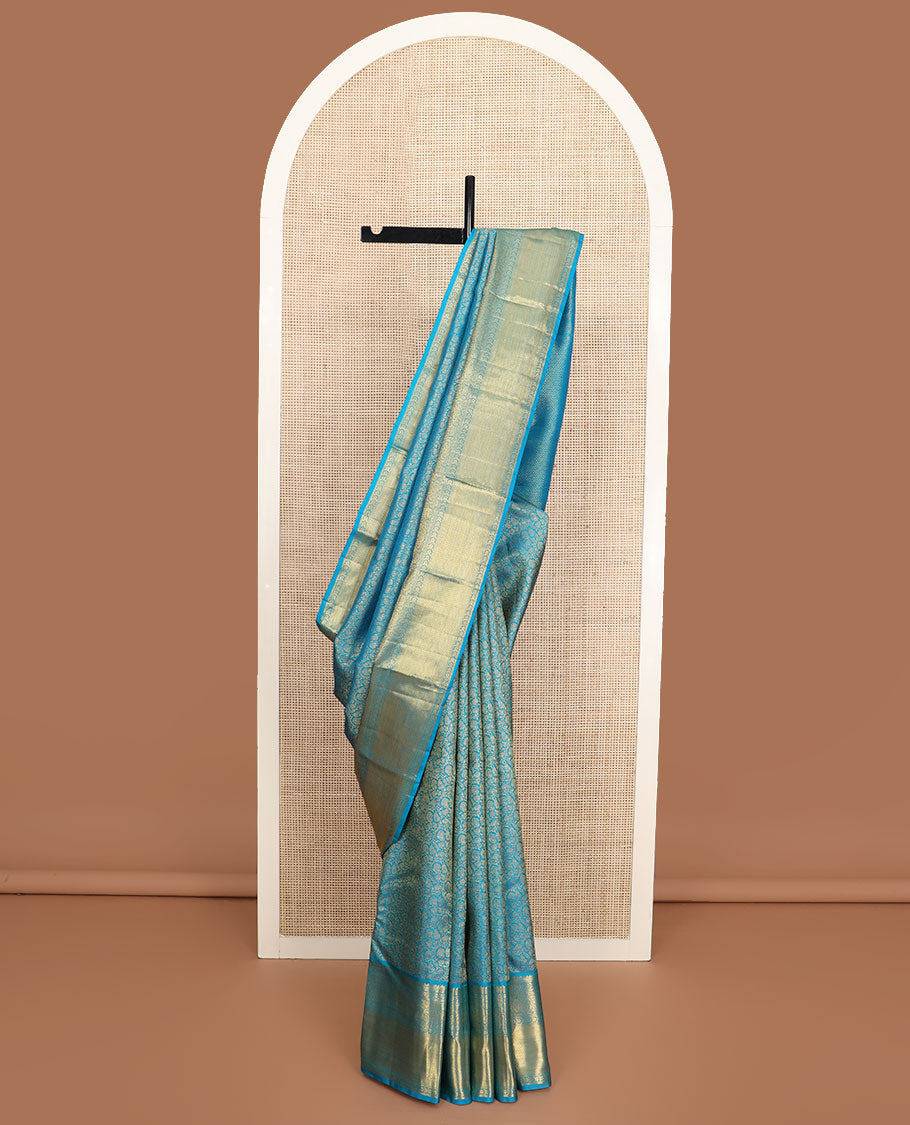 Blue floral jacquard Kanchipuram wedding silk saree, zari border of floral, manga, and mayil kann designs, and jaal pallu