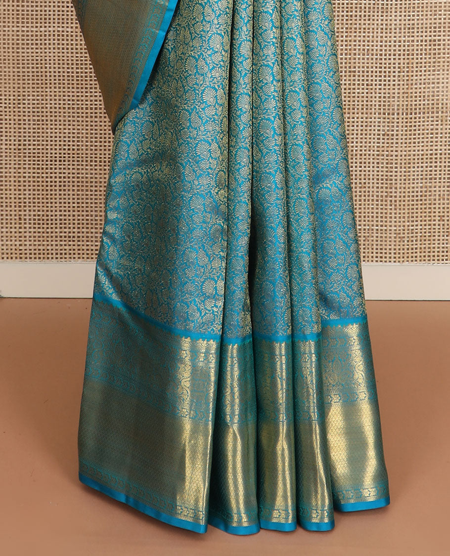 Blue floral jacquard Kanchipuram wedding silk saree, zari border of floral, manga, and mayil kann designs, and jaal pallu